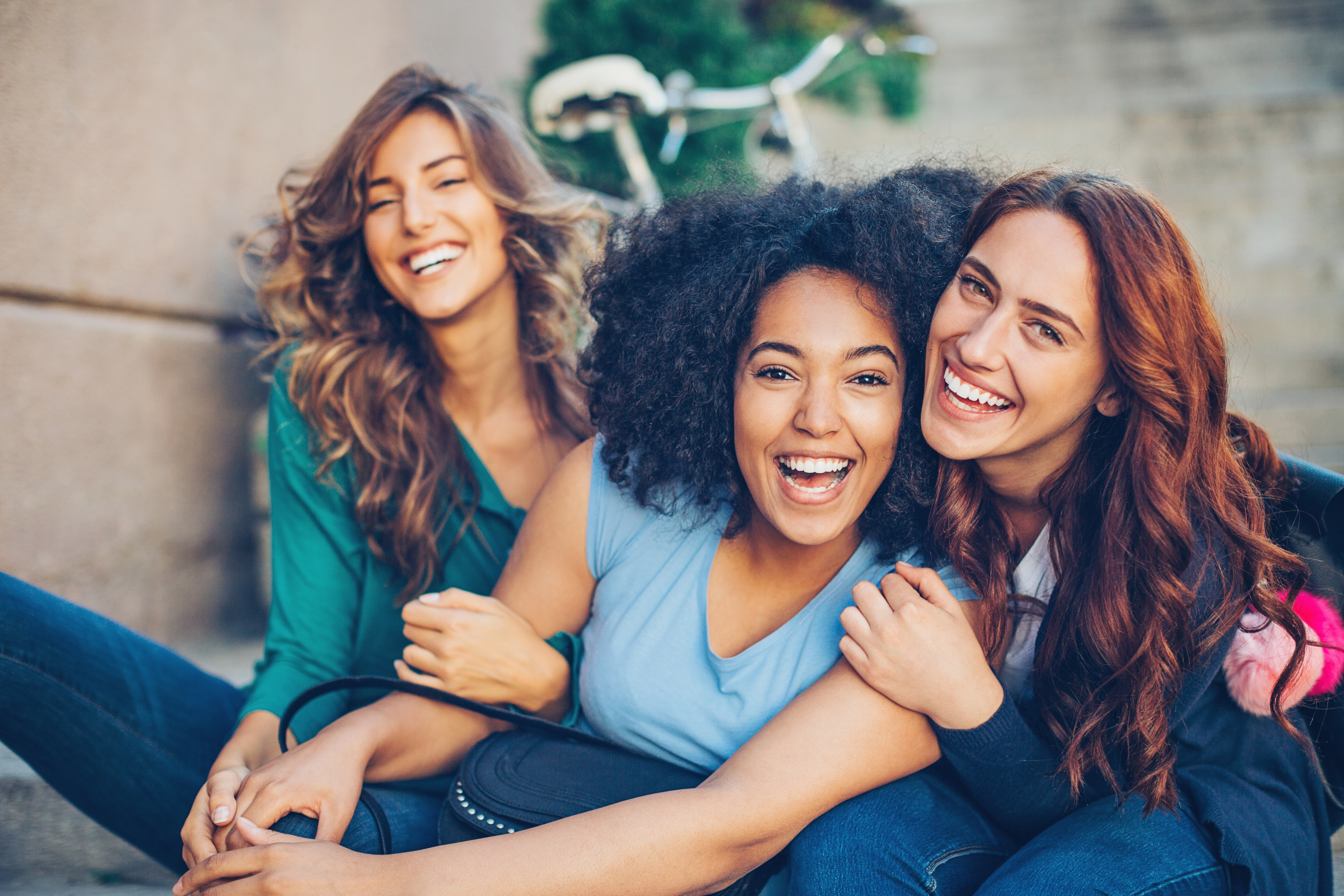 Young vulnerable adults smiling and laughing in supported living