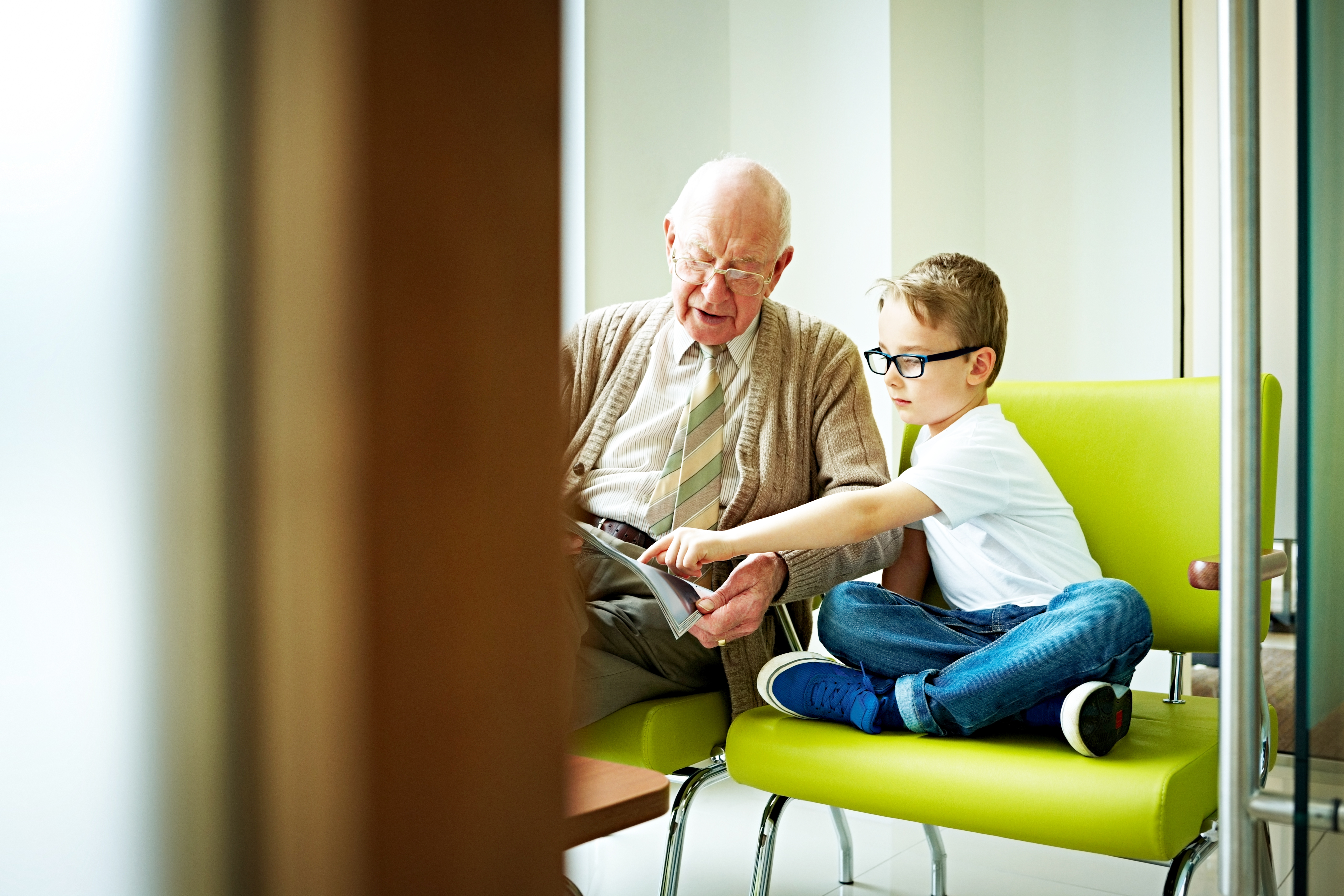 Vulnerable adults sat at Falcon Housing Association looking at supported living home