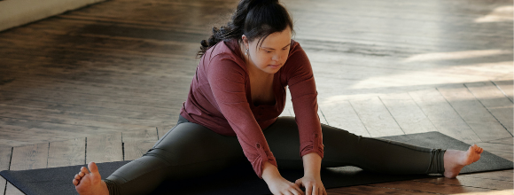 woman with prader-willi syndrome stretching